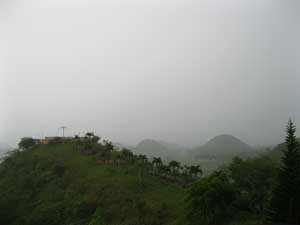 Chocolate Hills from the Sagbayan Peak on a rainy day - viewing deck in the forground 