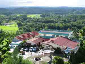 View from Chocolate Hills view deck at Carmen - looking down to restaurant and souvenir area